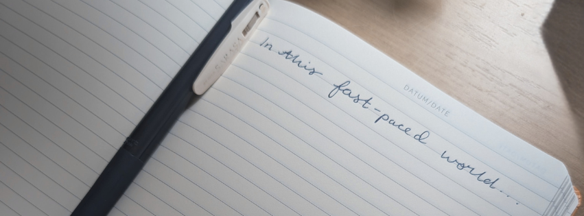 handwritten line written on a notebook page, using a popular ai phrase, to show the perfection fatigue against ai content. 